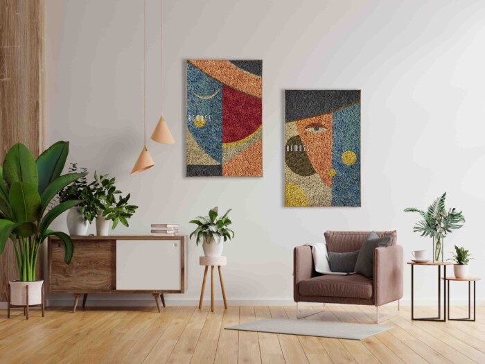 Un salon moderne avec du parquet et des murs blancs, avec deux œuvres d'art abstraites colorées au mur. Une plante en pot se trouve sur une armoire de style milieu du siècle à gauche, complétée par des installations Abstract Machio. Un fauteuil douillet avec un oreiller se trouve à droite, à côté d'une petite table ronde avec une plante.